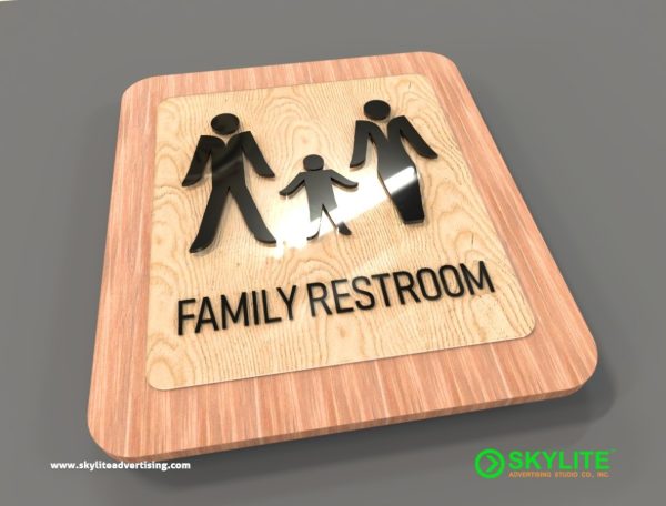 acrylic family restroom sign on wood