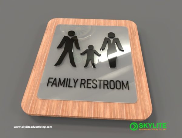 frosted acrylic family restroom sign on wood backing